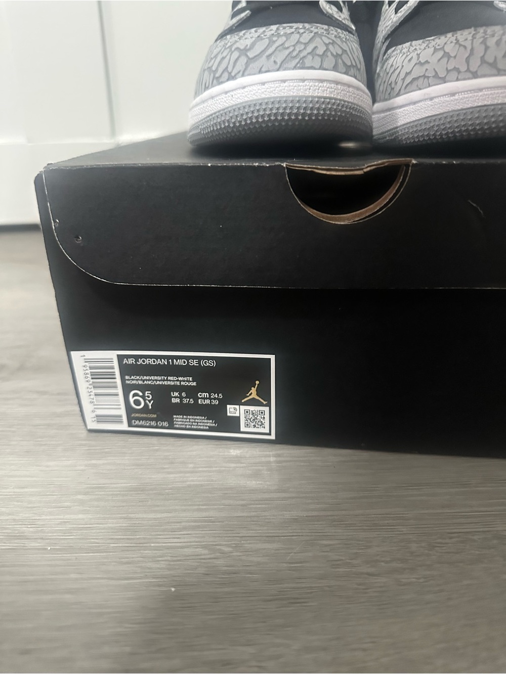 Jordan 1 Mid SE Youth Sneaker in Black and Gray Elephant Print